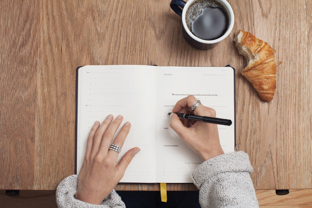 Woman at Desk Writing in Affirmation Journal