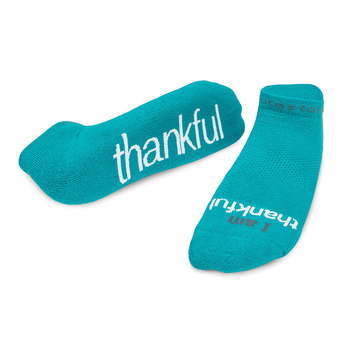 ornament with I am thankful™ teal socks