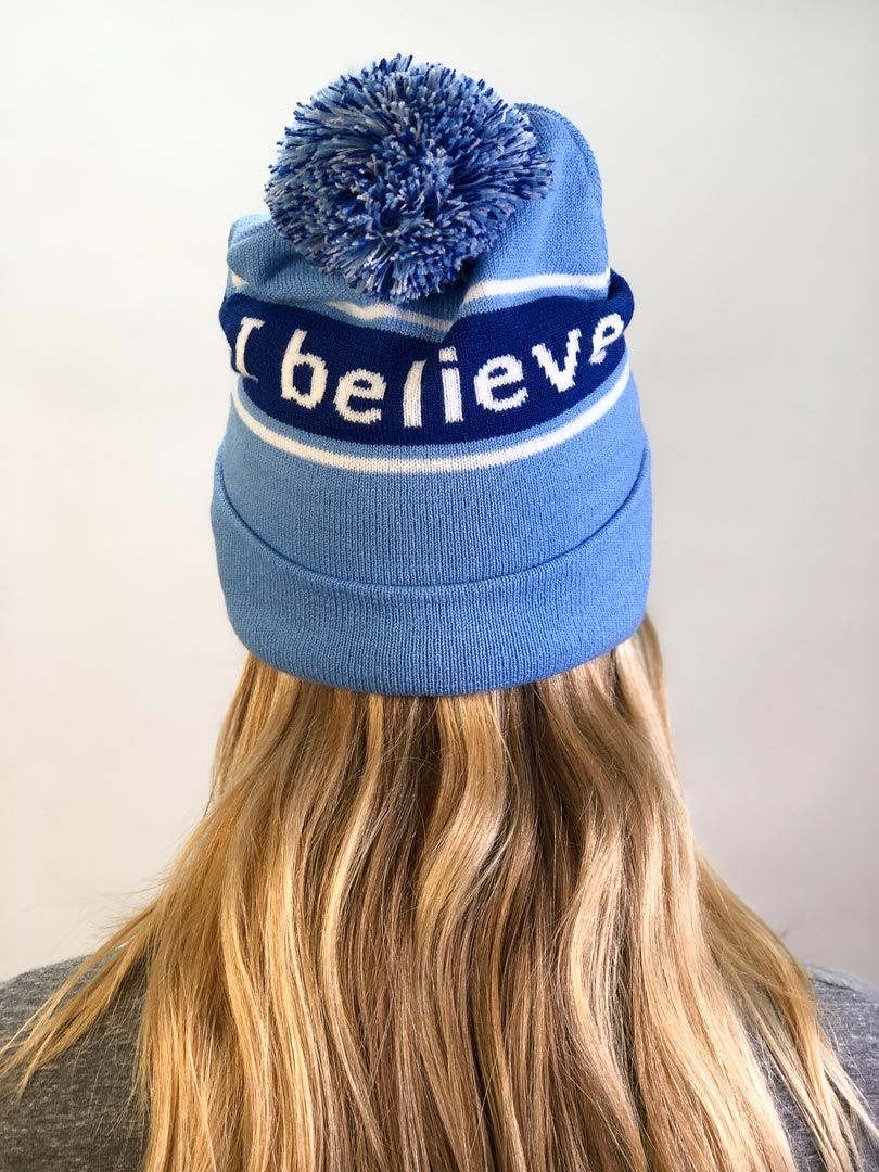 I believe™ blue knit beanie with I am optimistic™ on inside cuff