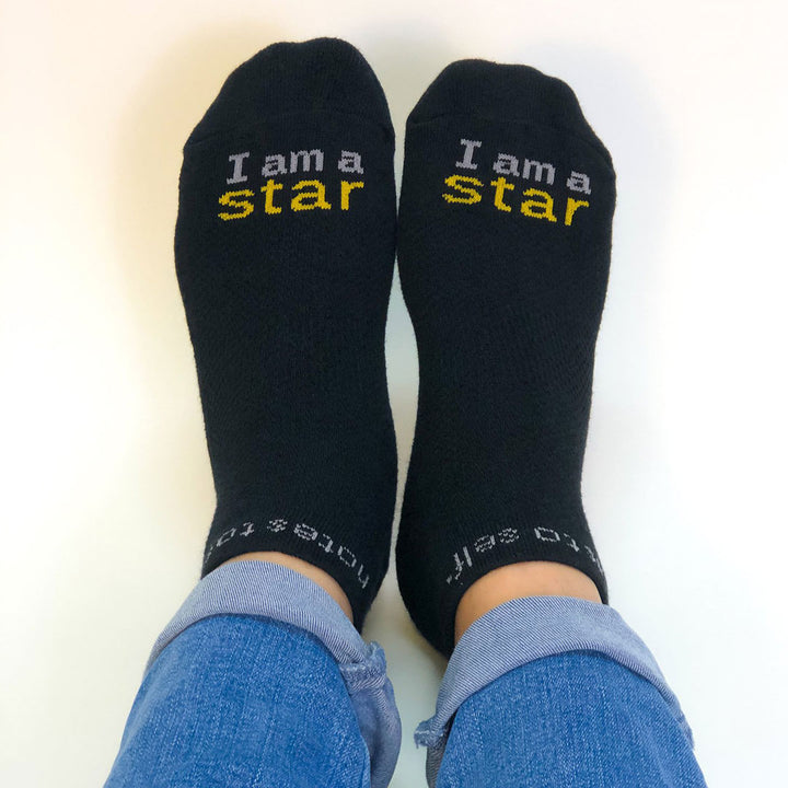 i am a star black socks with inspirational message