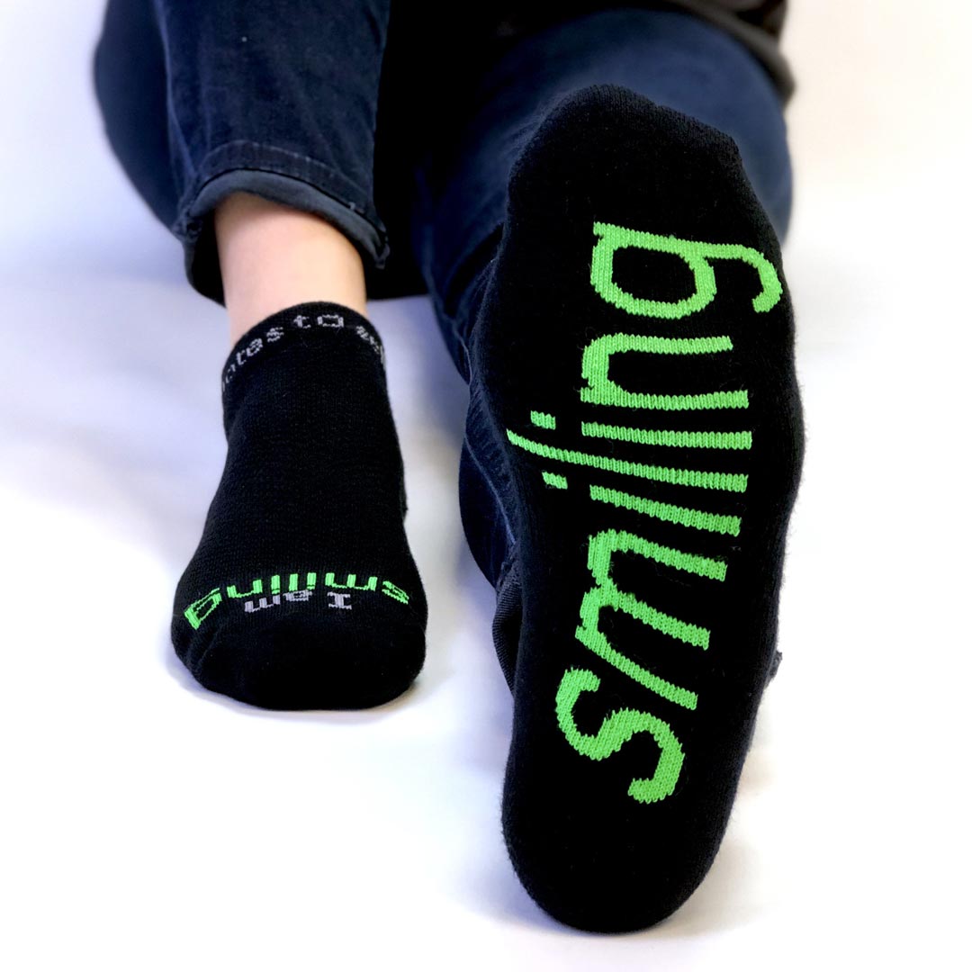 i am smiling black socks with positive message