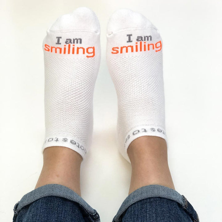 i am smiling white socks with positive message