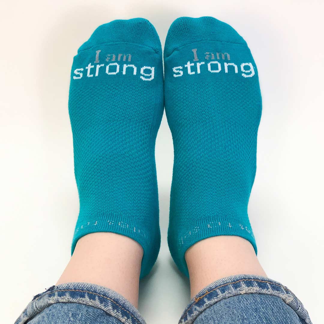 i am strong teal blue socks with motivational message