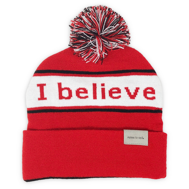 i believe beanie red with black and white pom